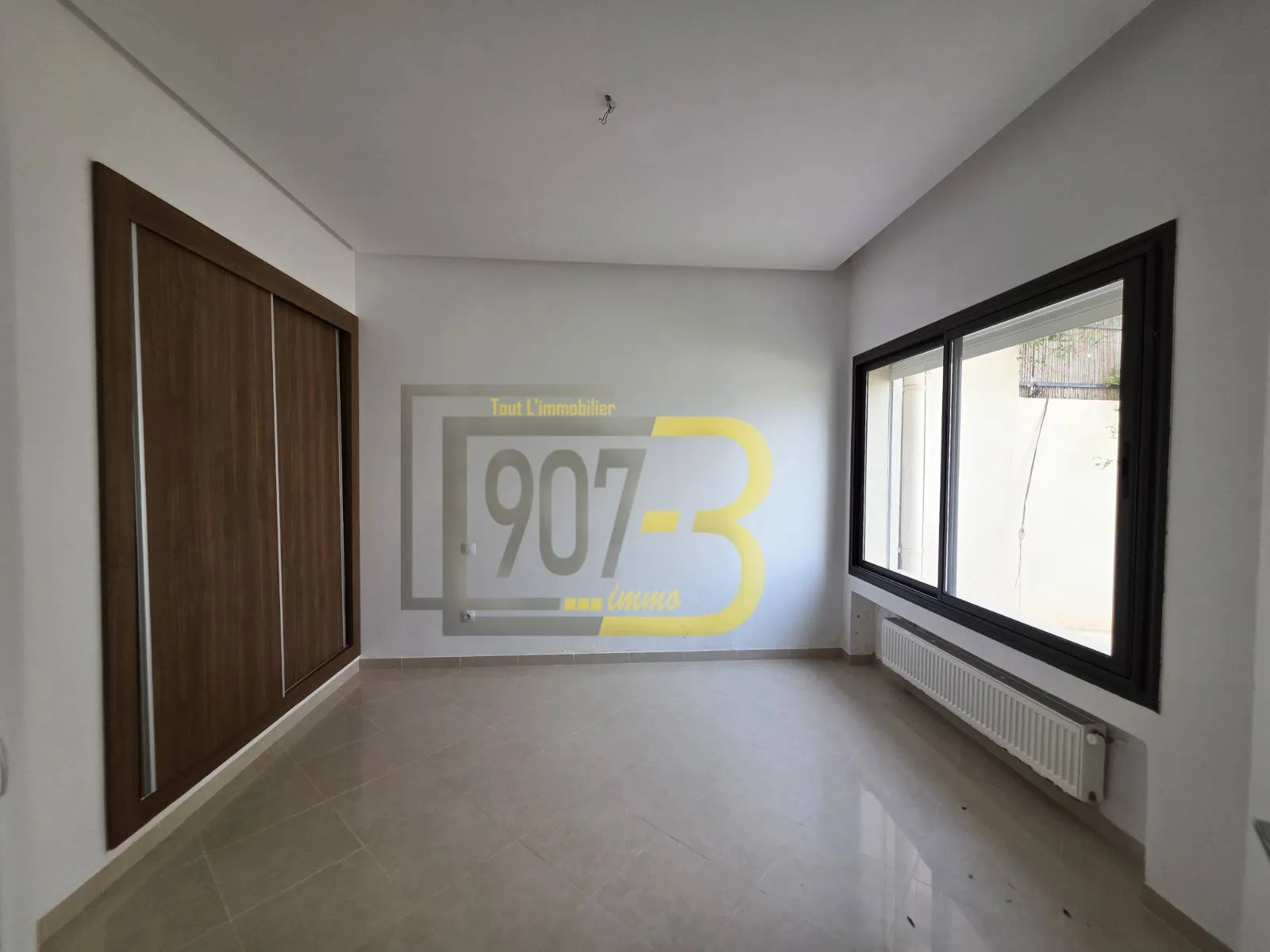 a Louer un appartement s+2 avec jardin à enassr 2
