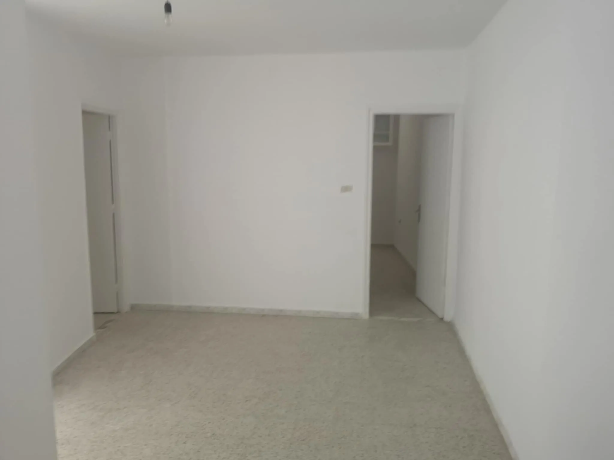 un appartement RDC s+2 vide situé à Menzah 9c