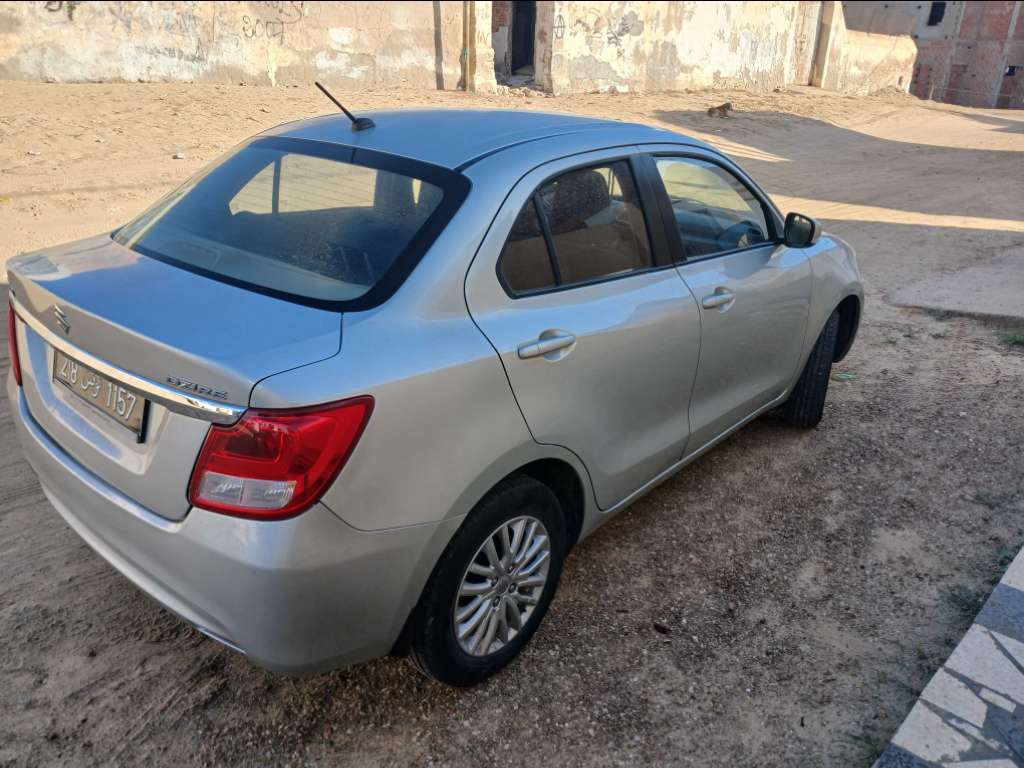 SUZUKI DZIRE 1er main ESSENCE Tel 24 313 594