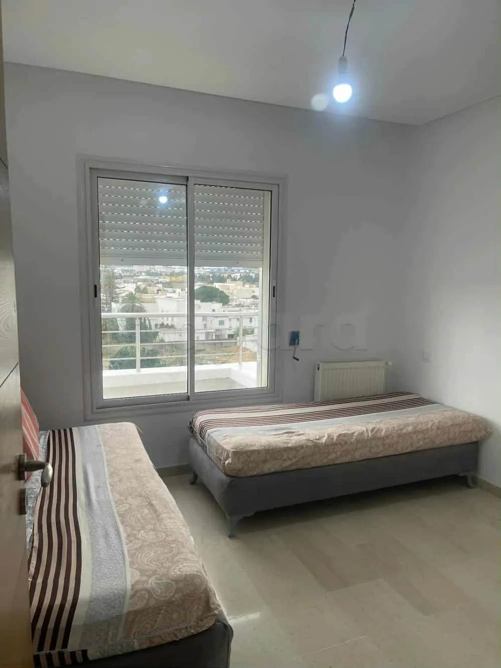 un appartements s+2 au 6 éme étage(avec ascenseur)a louer a Manouba Centre Prés de Terrain Masmoudi.