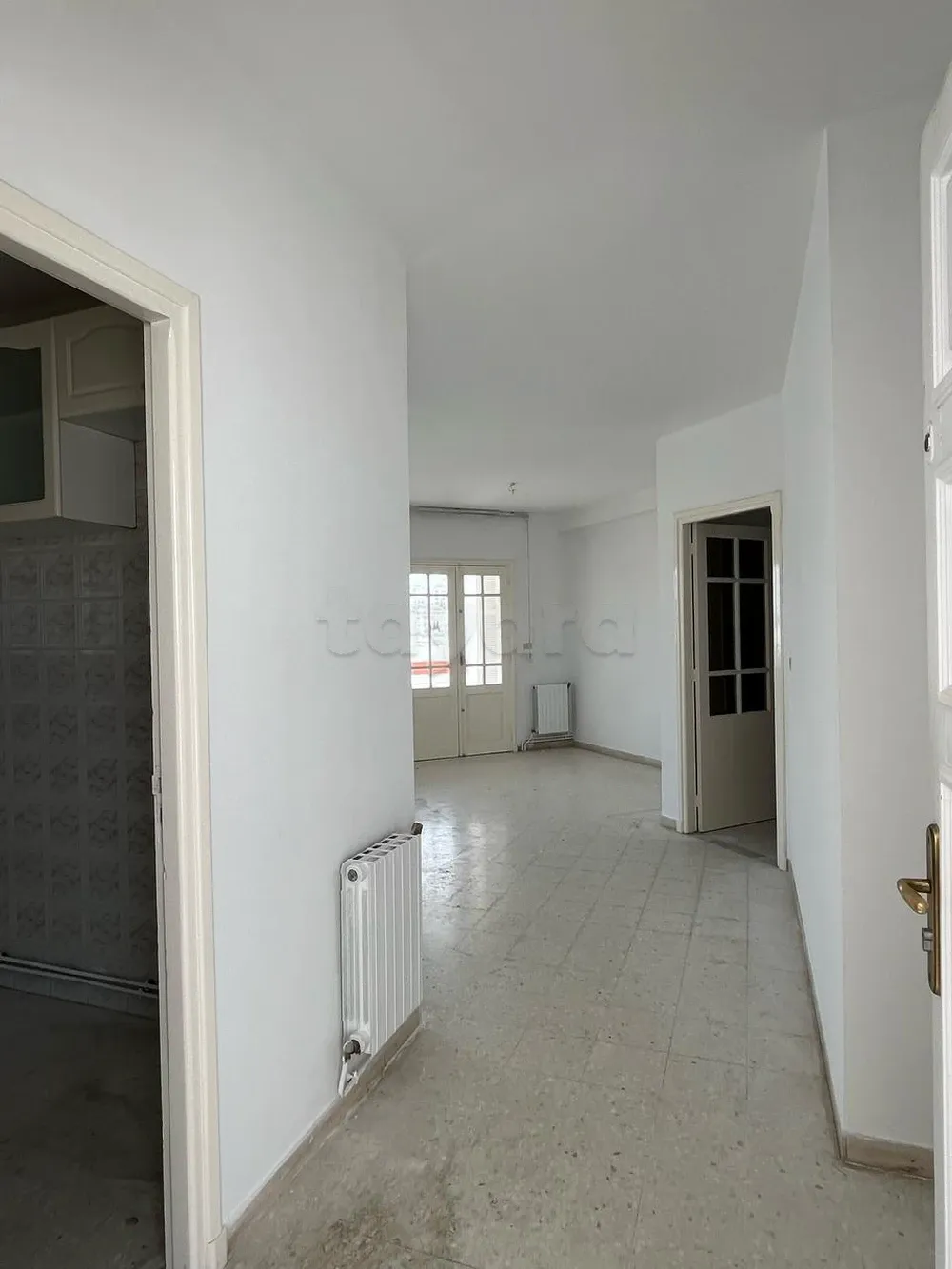 un appartement S+3 situé cité ENNASR 1