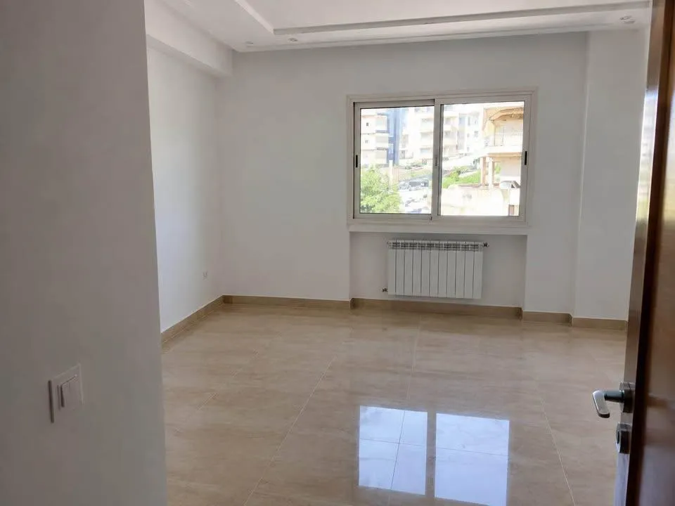 un appartement s+2 HS au 2éme étage(avec ascenseur) a louer a jardin d'el manzah 2 prés de monoprix
