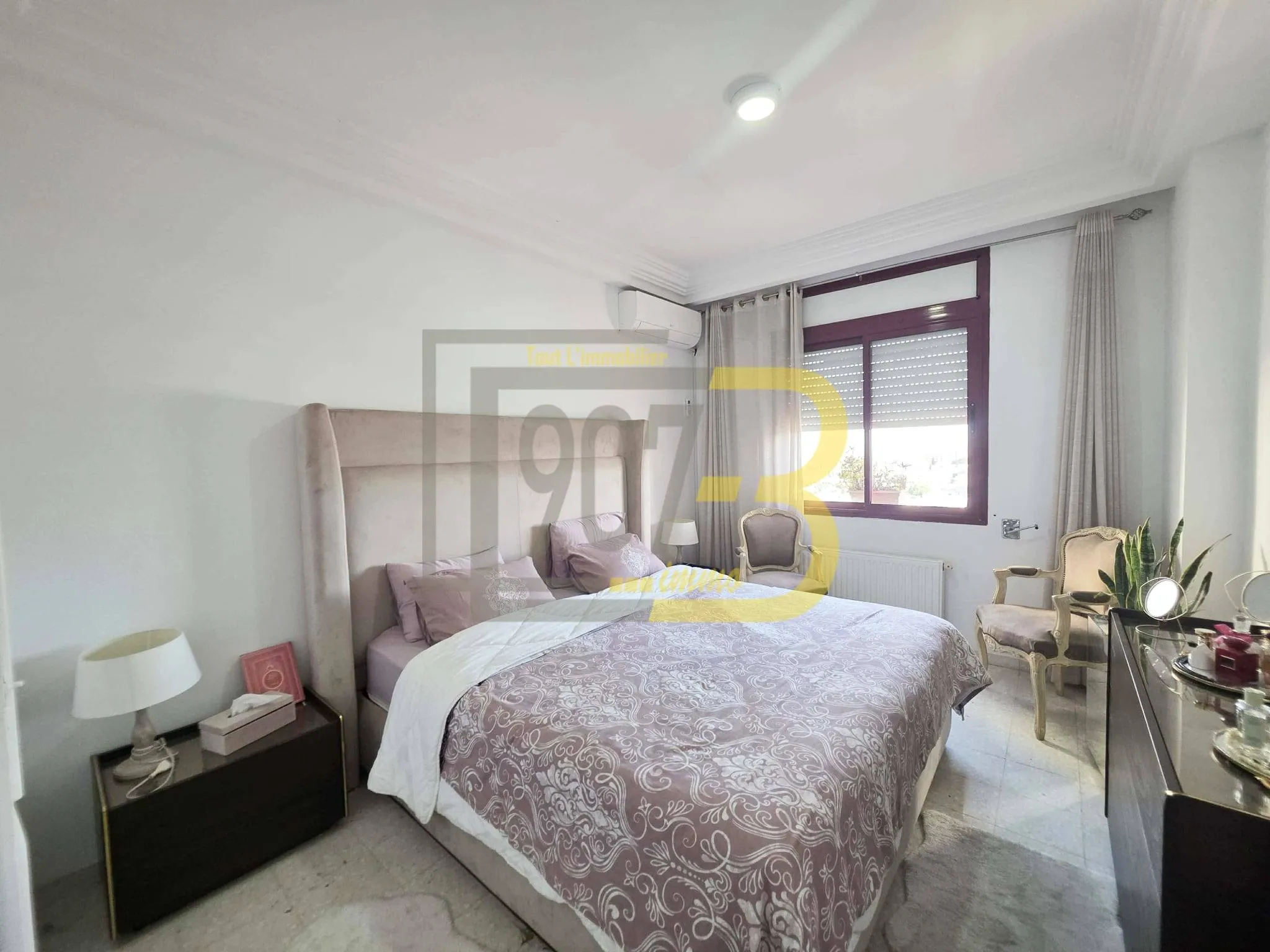 A vendre un appartement s+3 retapé à  cité Ennasr